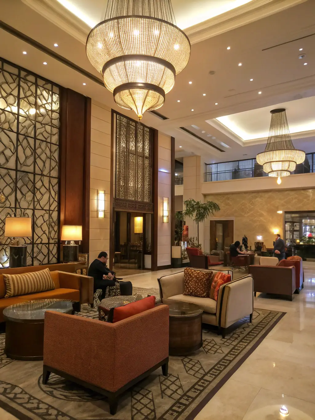 A stylish hotel lobby with modern furniture, ambient lighting, and elegant decor, showcasing MAN General Contracting LLC's ability to create inviting and sophisticated hospitality environments.